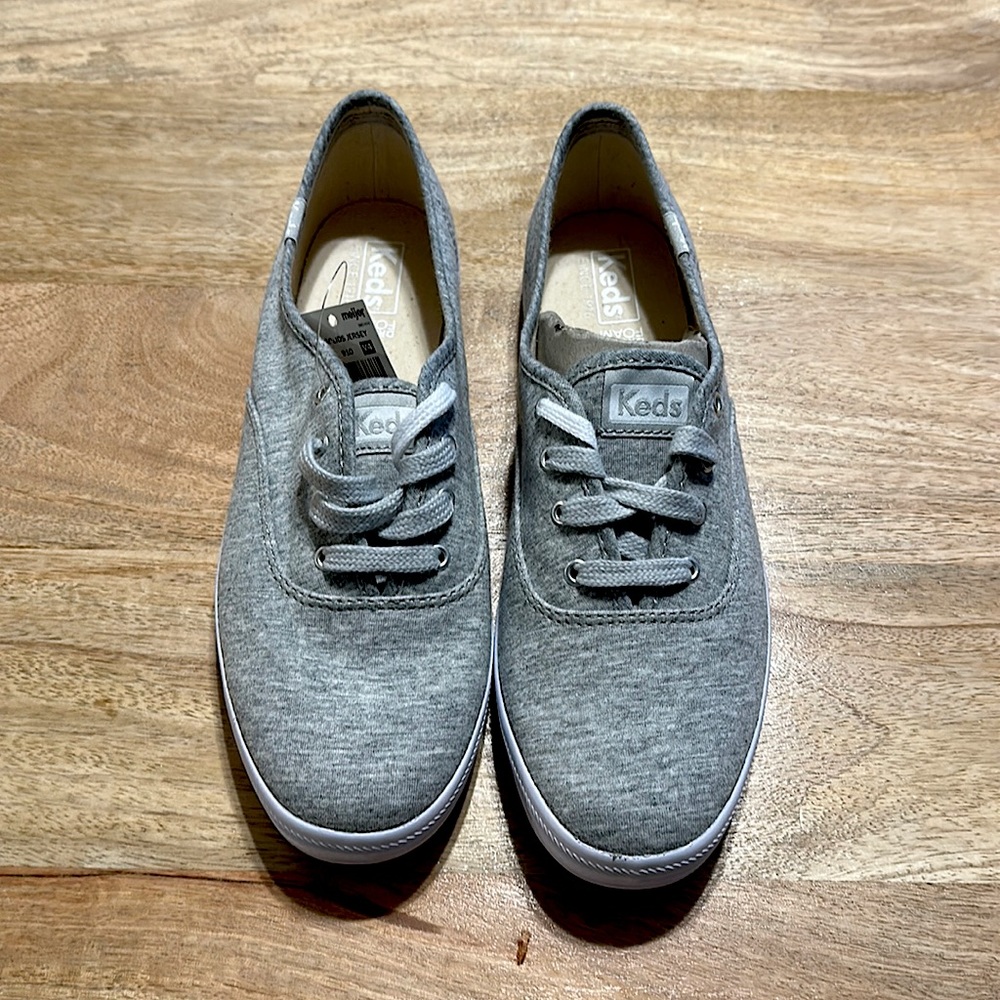 Brand new, never worn Women’s 8.5 Keds Dream Foam. Champion Jersey Light Gray